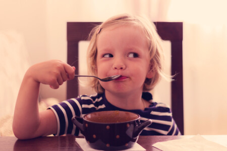 Little Cute Girl Eats Soup.