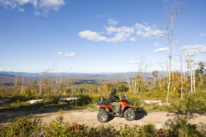 A Man Rides His Atv On A Ridge At Jericho Mountain State Park In Berlin, New Hampshire. White Mountains.